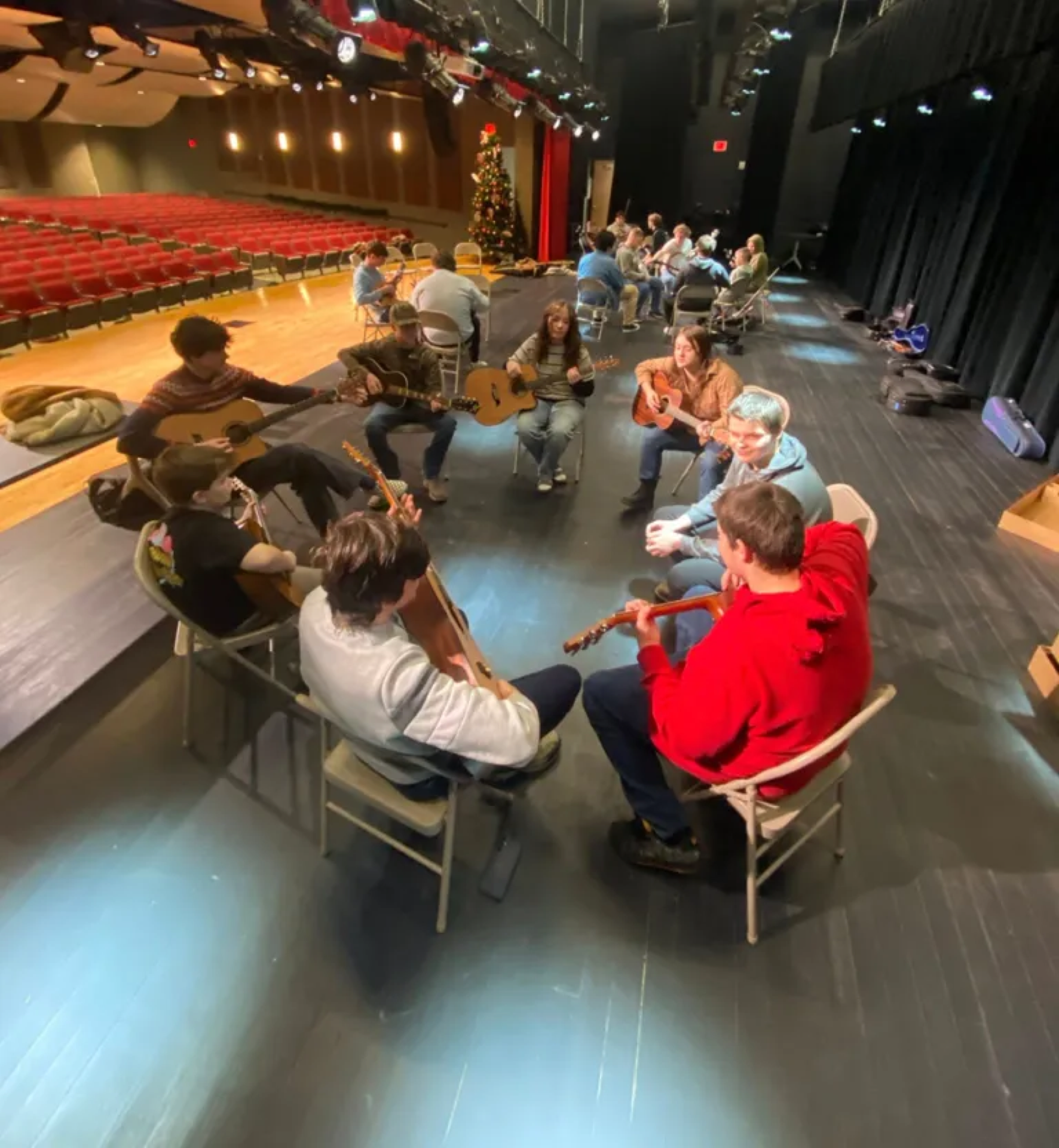 Pick and Bow students and mentors in a group jam session